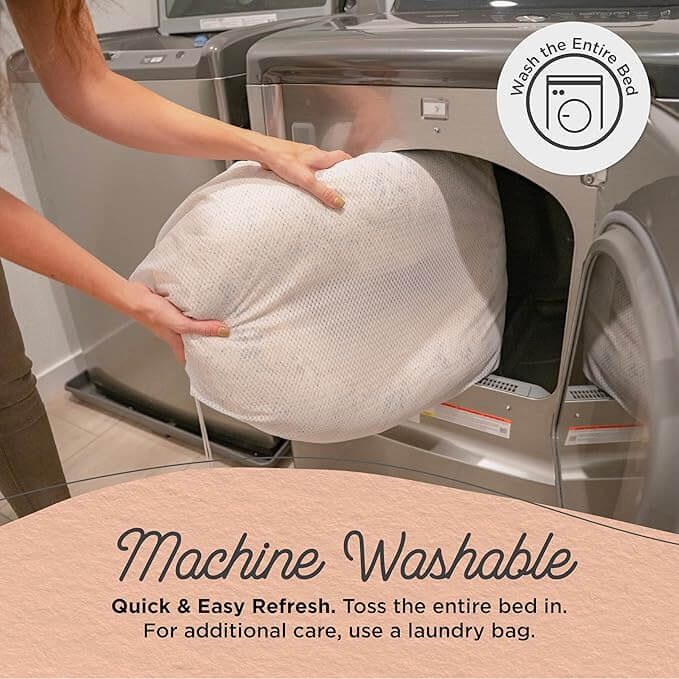 Machine washable donut dog bed being cleaned in laundry