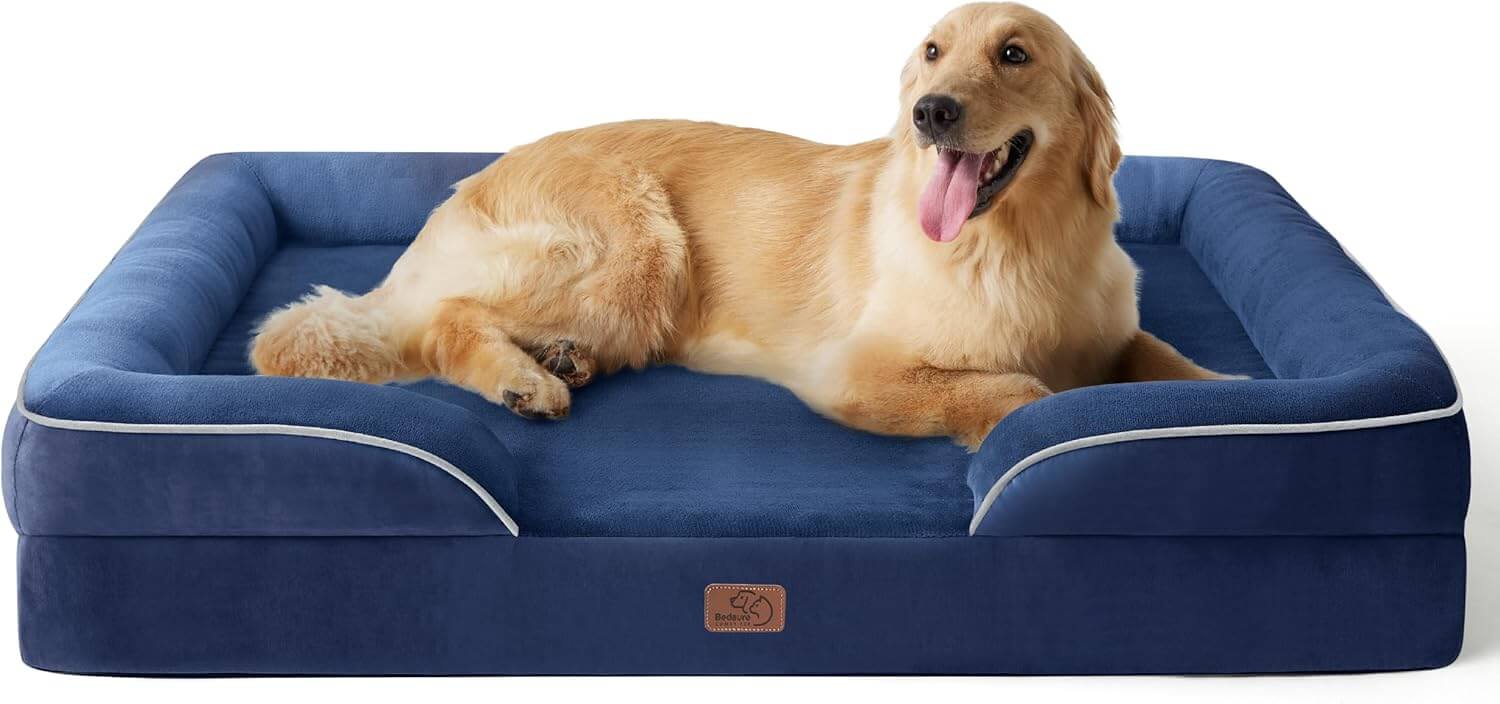 Large dog comfortably resting on navy orthopedic sofa-style bed with raised sides