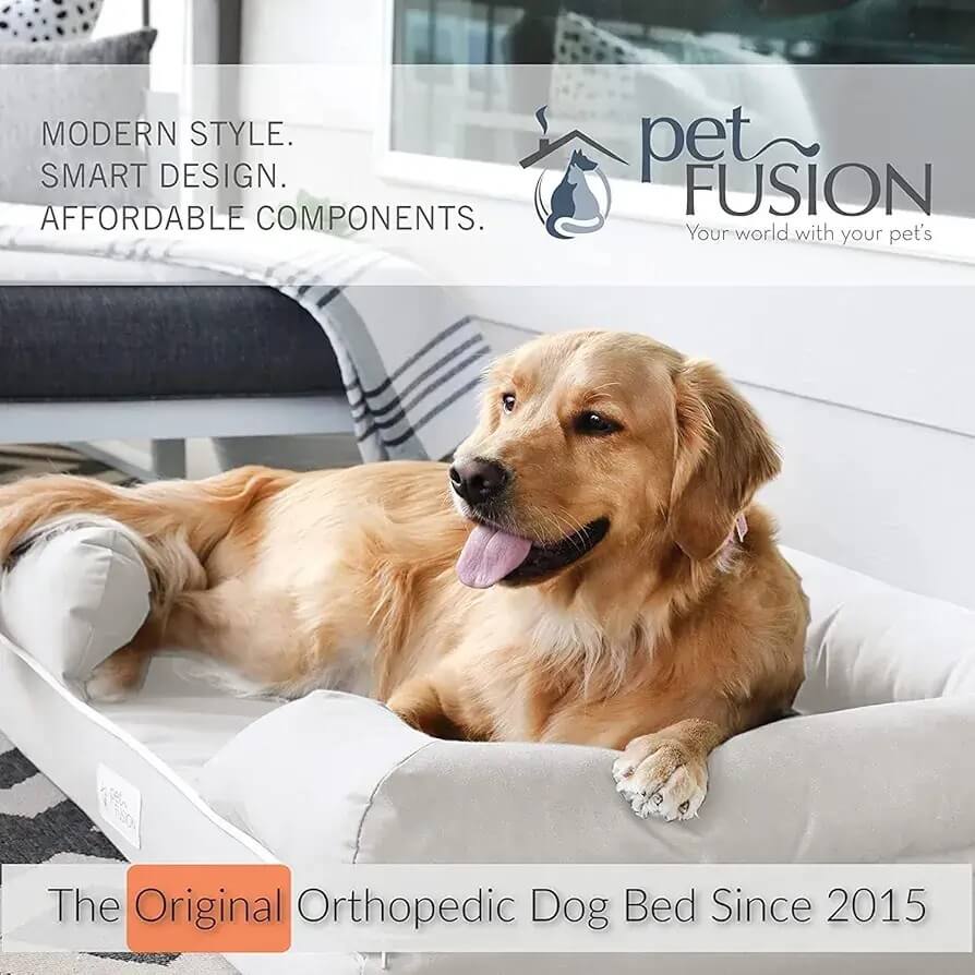 Golden Retriever resting on the PetFusion Ultimate Orthopedic Dog Bed in a modern living room